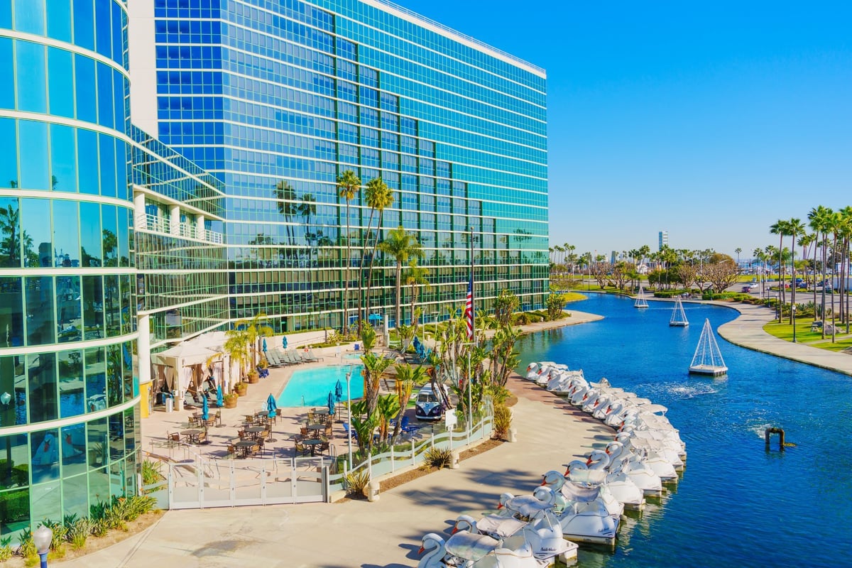 Aerial perspective of luxury hotel featuring pool area and waterfront views