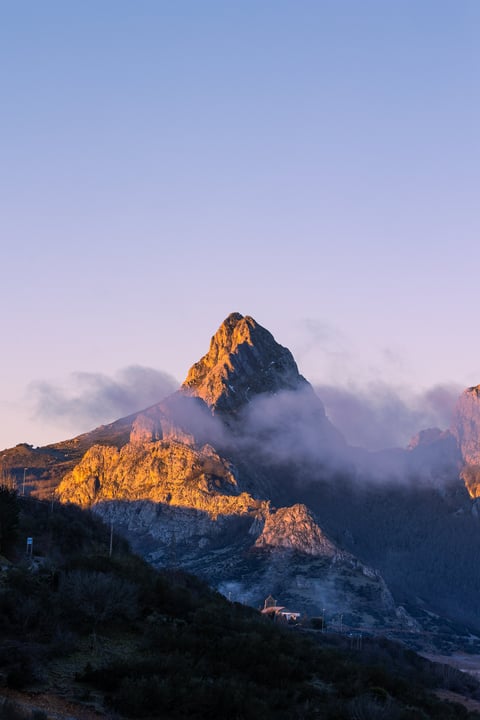Mount Olympus peak with fog and sunrise
