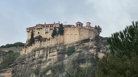 Medieval castle perched on rocky hilltop